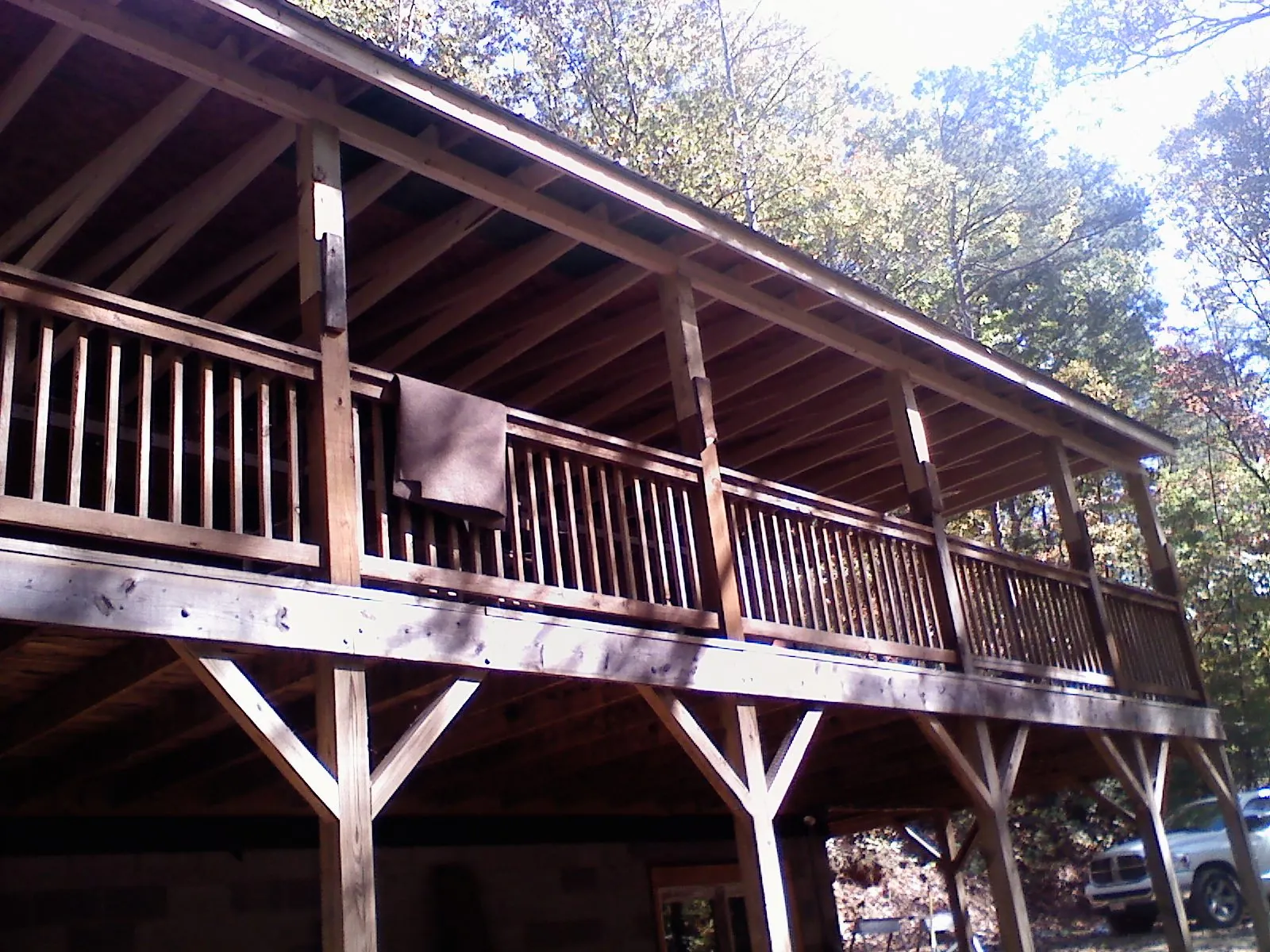 Timber framing under a new elevated porch and deck — Roof Leak Repair in South Londonderry by Roofing Brothers